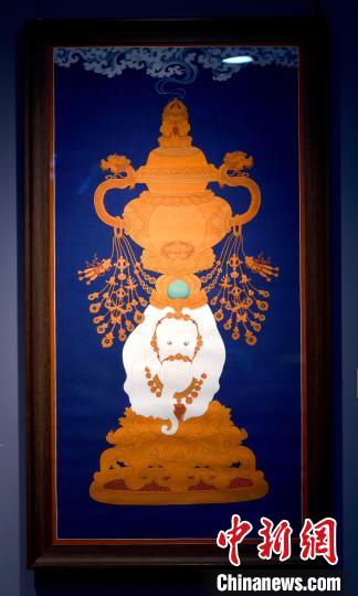 圖為5月16日，展覽中的新創(chuàng)唐卡作品《瑞象承香》?！±盍?攝