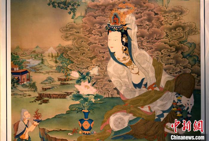 圖為5月16日，展覽中新創(chuàng)唐卡作品《靜息觀音》(局部)?！±盍?攝